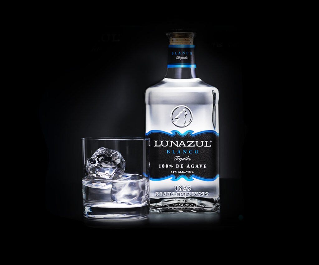 Lunazul bottle with a glass of tequila